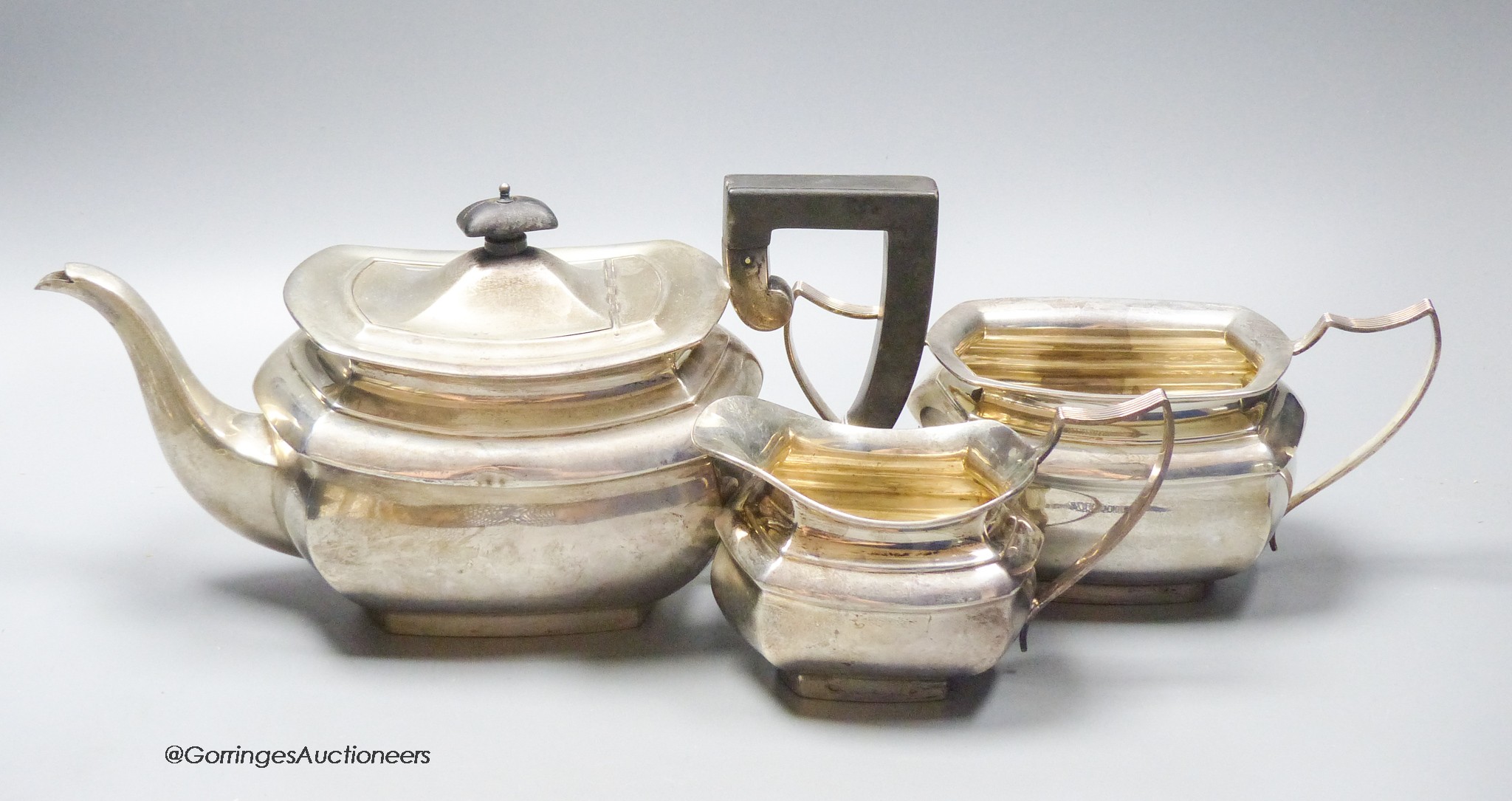 A George V silver three piece tea set by A&J Zimmerman & Co, Birmingham, 1921